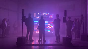 Screenshot of Video installation with people looking at it