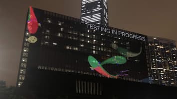 Screenshot of Close look at M+ facade showing Touch for Luck in testing mode